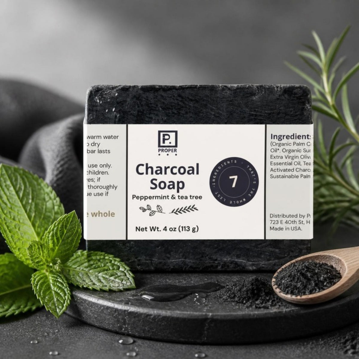 Proper Charcoal Soap on black stone with mint and activated charcoal