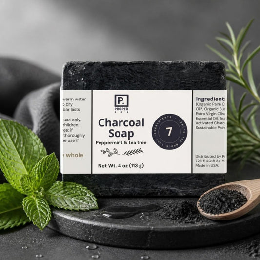 Proper Charcoal Soap on black stone with mint and activated charcoal
